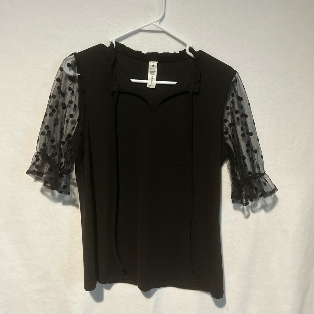 Adorable black top with see through short sleeves